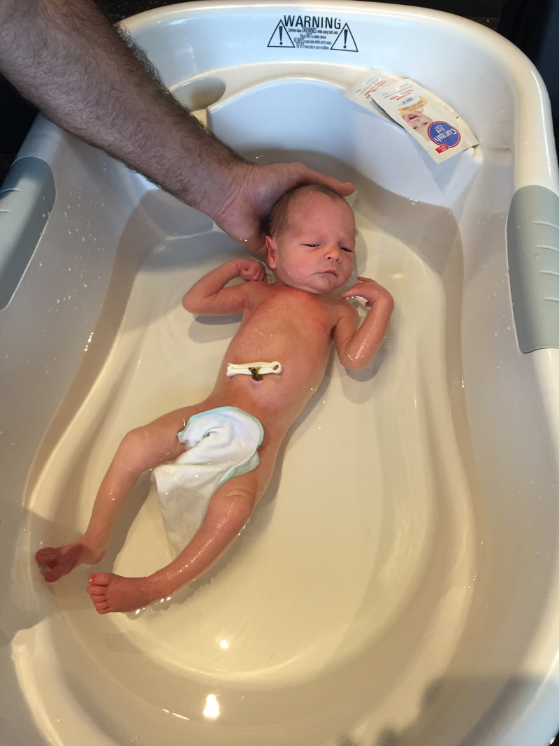 bathing baby in big bath
